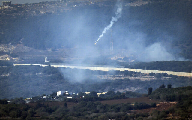 Flares are fired from northern Israel over the southern Lebanese border village of Aita al-Shaab, on October 28, 2023. (FADEL SENNA / AFP)