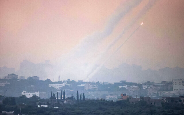 A salvo of rockets fired from inside the Gaza Strip towards Israel on October 31, 2023. (Menahem KAHANA / AFP)