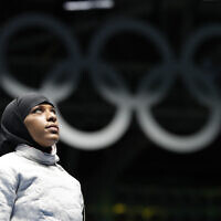 Ibtihaj Muhammad of the United States, waits for a match in the women's saber individual fencing event at the Summer Olympics in Rio de Janeiro, August 8, 2016. (Vincent Thian/AP)