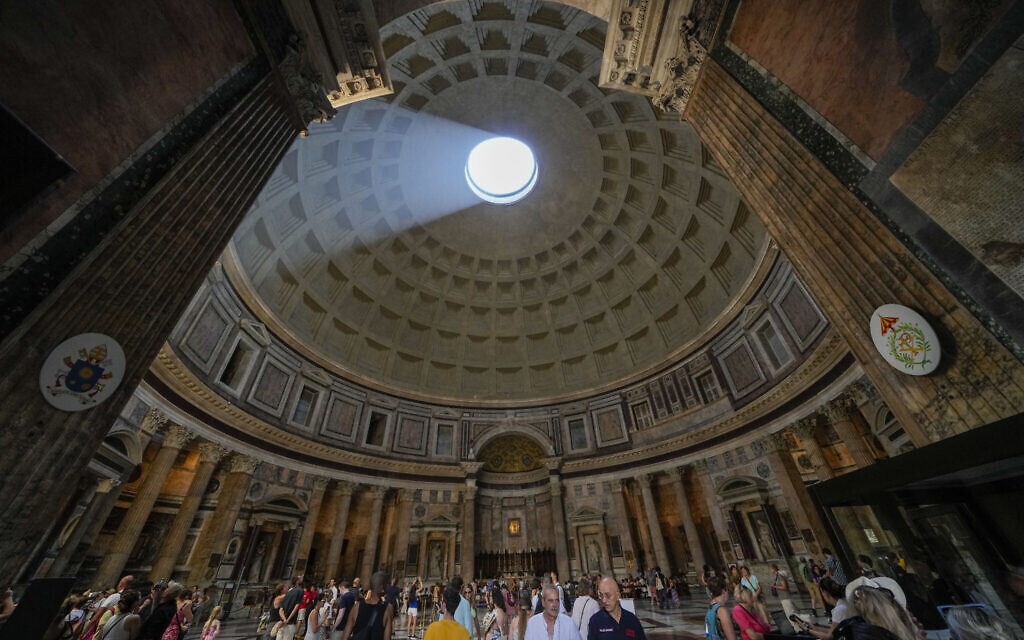 Visitors tour the interior of the Pantheon's dome in Rome, on Thursday, Aug. 24, 2023. The structure was built under Roman Emperor Augustus between 27-25 BC to celebrate all gods worshipped in ancient Rome and rebuilt under Emperor Hadrian between 118 and 128 A.D.  (AP Photo/Andrew Medichini)