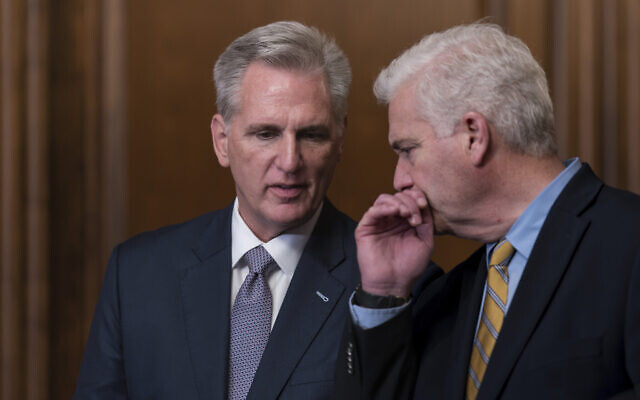 Speaker of the House Kevin McCarthy, R-Calif., confers with Majority Whip Tom Emmer, R-Minn., right, just after the House approved a 45-day funding bill to keep federal agencies open, but the measure must first go to the Senate, at the Capitol in Washington, September 30, 2023. (AP Photo/J. Scott Applewhite)