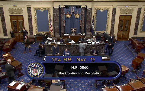 This image from U.S. Senate video shows the vote total, 88-9, on a temporary funding bill in the Senate at the U.S. Capitol in Washington, Saturday, Sept. 30, 2023. (Senate Television via AP)