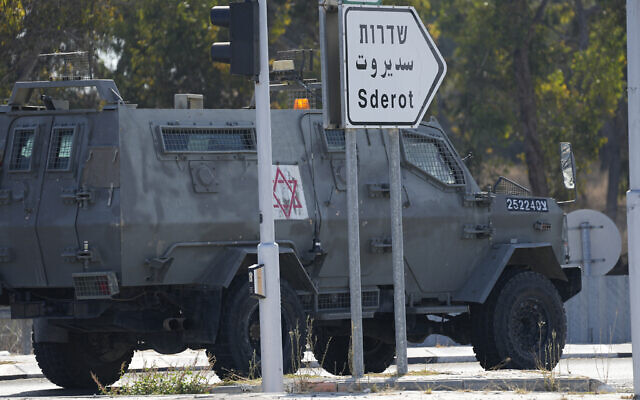 Israeli military vehicle heads towards the south on October 7, 2023 (AP Photo/Ohad Zwigenberg)