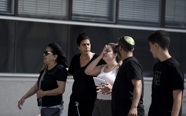 A family arrives to a police station in Lod, to provide DNA samples to help identify a relative missing since an unprecedented mass terror attack by Hamas, in southern Israel, October 8, 2023. (AP Photo/Maya Alleruzzo)