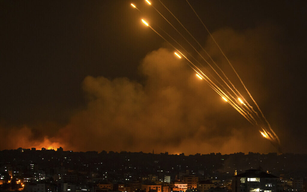 Rockets are fired toward Israel from the Gaza Strip, October 8, 2023. (AP Photo/ Fatima Shbair)