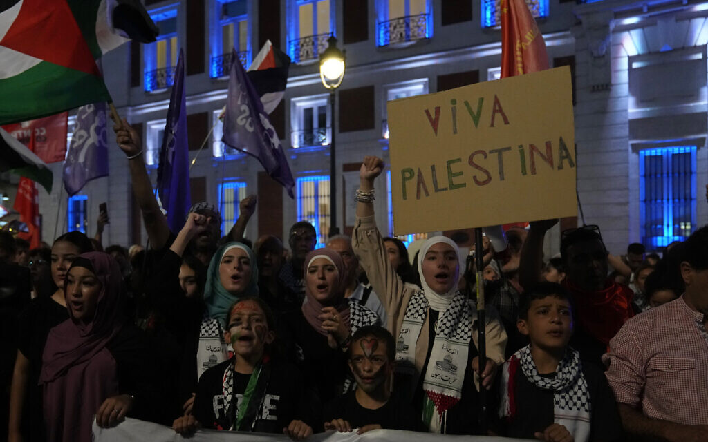 Demonstrators protest against Israeli airstrikes on Gaza in the Puerta del Sol in central Madrid, Spain, October 9, 2023. (AP Photo/Paul White)