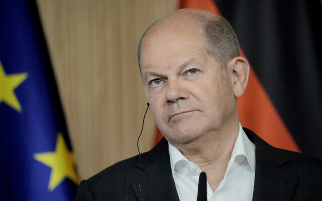 German Chancellor Olaf Scholz listens at a press conference after a joint cabinet meeting of the German and French Government in Hamburg, Germany, October 10, 2023. (Markus Schreiber/AP)