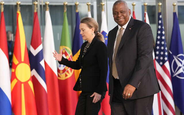 United States Secretary of Defense Lloyd Austin, right, arrives for a meeting of NATO defense ministers at NATO headquarters in Brussels, Wednesday, Oct. 11, 2023. (AP Photo/Virginia Mayo)