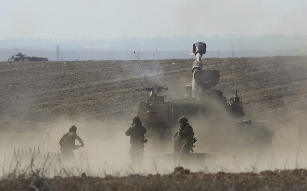 An Israeli mobile artillery unit fired a shell from southern Israel towards the Gaza Strip, in a position a near the Israel Gaza border, Israel, Wednesday, Oct. 11, 2023. (AP/Erik Marmor)