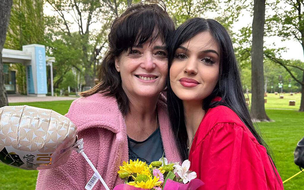 Judith Raanan, left, and her daughter Natalie, 18, after Natalie's recent high school graduation. Undated photo provided by Rabbi Meir Hecht on behalf of the Raanan family (Raanan Family via AP)