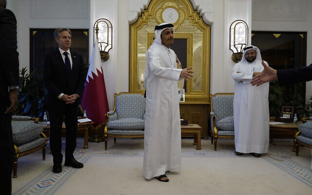 Qatar's Prime Minister and Foreign Minister Mohammed bin Abdulrahman Al Thani, center, and U.S. Secretary of State Antony Blinken, left, attend a meeting, in Doha, Qatar, Friday Oct. 13, 2023. (AP Photo/Jacquelyn Martin, Pool)