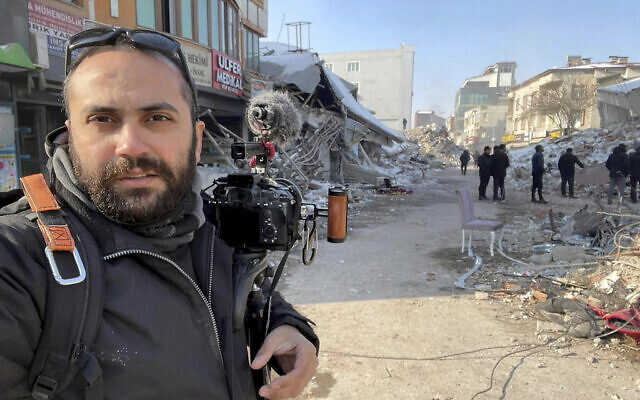 In this photo provided by Reuters, Issam Abdallah, a videographer for the news agency, poses for a selfie while working in Maras, Turkey, on Feb. 11, 2023. Abdallah was killed Friday, Oct. 13, 2023, when an Israeli shell landed in a gathering of international journalists covering clashes on the border in south Lebanon. Six other journalists were injured in the incident. (Issam Abdallah/Reuters via AP)