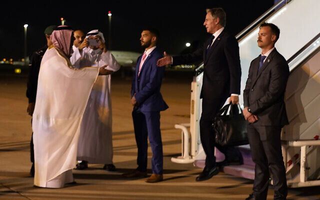 US Secretary of State Antony Blinken arrives in Riyadh, Saudi Arabia, Friday Oct. 13, 2023, and is greeted by MFA Undersecretary for Protocol Affairs Abdulmajeed Alsmari after stops in Jordan, Qatar, and Bahrain in the same day. (AP Photo/Jacquelyn Martin, Pool)