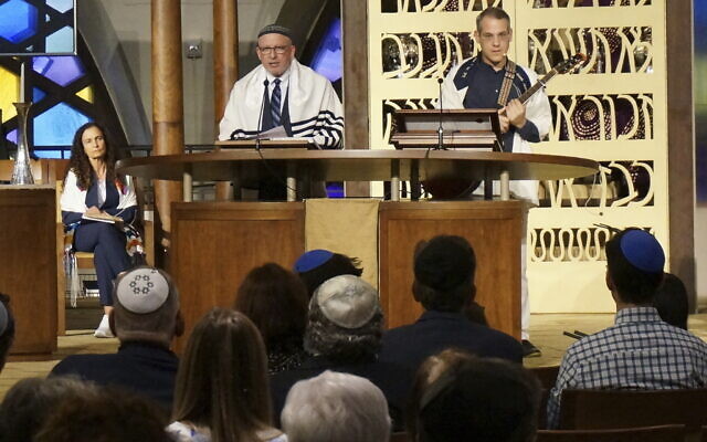 Senior Rabbi Gayle Pomerantz (seated, left), Rabbi Robert Davis and Cantor Juval Porat lead Shabbat services at Temple Beth Sholom in Miami Beach, Fla., on Friday, October 13, 2023. (Giovanna Dell'Orto/AP)