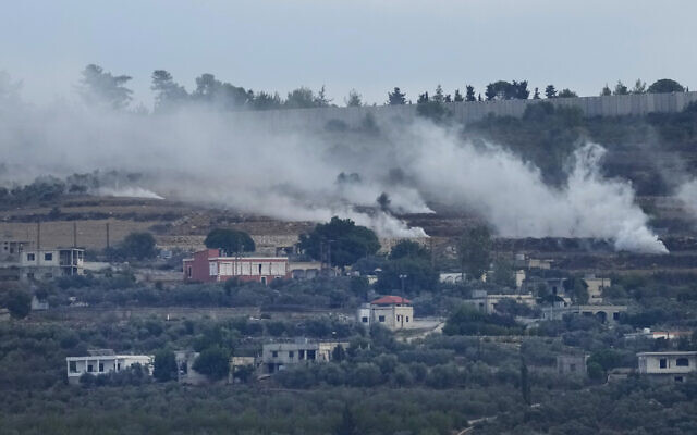 Smoke rises following an Israeli artillery strike in al-Bustan, a Lebanese border village with Israel, south Lebanon, Oct. 18, 2023. (AP Photo/Hussein Malla)