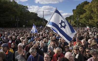 People wave Israeli flags during a demonstration against antisemitism and to show solidarity with Israel in Berlin, Germany, October 22, 2023. (AP Photo/Markus Schreiber)