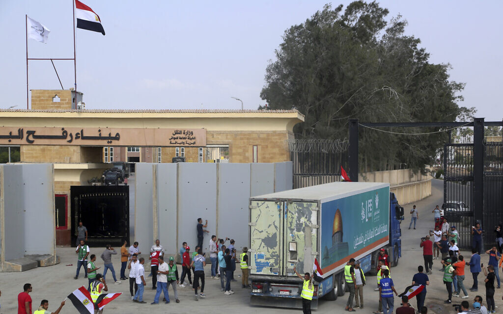 A truck carrying humanitarian aid for the Gaza Strip crosses the Rafah border gate in Rafah, Egypt, October 22, 2023. (AP Photo/ Mohammed Asad)