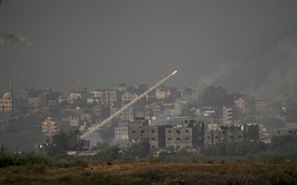 Rockets are fired toward Israel from the Gaza Strip, as seen from southern Israel, October 23, 2023. (Ariel Schalit/AP)