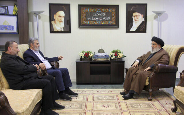 In this photo released on October 25, 2023, by the Hezbollah Media Relations Office, Hezbollah leader Hassan Nasrallah, right, meets with Ziad al-Nakhaleh, the head of Palestinian Islamic Jihad, center, and Hamas deputy chief, Saleh al-Arouri, in Beirut, Lebanon. (Hezbollah Media Relations Office, via AP )
