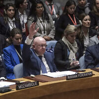 Russia's United Nations Ambassador Vasily Nebenzya raises his hand as he votes against a US resolution over the ongoing Israel-Hamas war that was vetoed in the UN Security Council, Wednesday, October 25, 2023. (AP Photo/Bebeto Matthews)