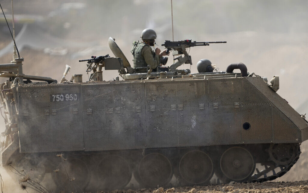 Israeli armored personnel carrier moves near the border with Gaza Strip on Tuesday, Oct. 31, 2023. (AP Photo/Ariel Schalit)