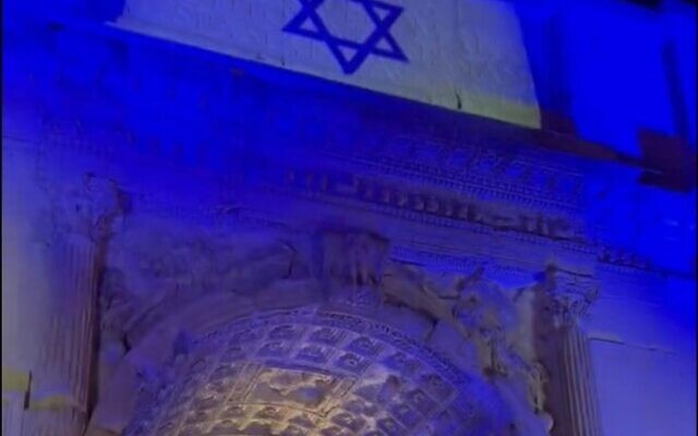 Screen capture from video of the Arch of Titus in Rome lit up in blue and white to show solidarity with Israel, October 11, 2023. (X. Used in accordance with Clause 27a of the Copyright Law)