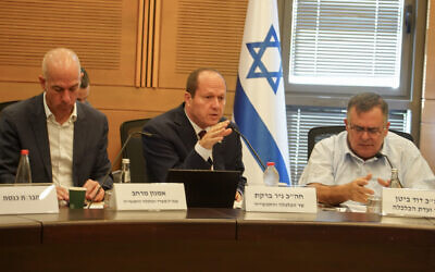 Economy Minister Nir Barkat (middle) speaks at Knesset Economy Committee meeting, October 25, 2023. (Courtesy)