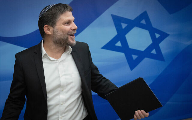 File: Finance Minister Bezalel Smotrich arrives to a weekly cabinet meeting at the Prime Minister's Office in Jerusalem on September 27, 2023. (Chaim Goldberg/Flash90)