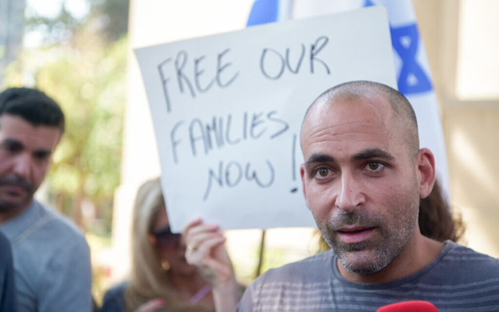 Avihai Brodutch, whose wife and three children were abducted by terrorists to Gaza, protests outside the Defense Ministry in Tel Aviv, October 14, 2023 (Avshalom Sassoni/FLASH90)