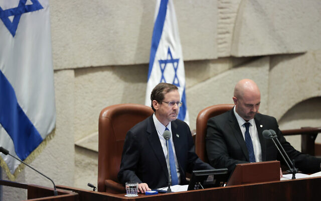 President Isaac Herzog speaks at the opening session of the Knesset's winter session, in the Knesset plenum in Jerusalem, October 16, 2023. (Noam Revkin Fenton/Flash90)