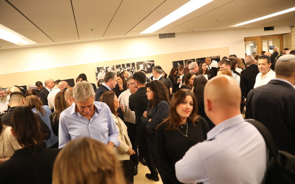 Knesset members and other parliament employees and attendants gather in a bomb shelter as rocket sirens sound in Jerusalem, October 16, 2023. (Noam Revkin Fenton/Flash90)