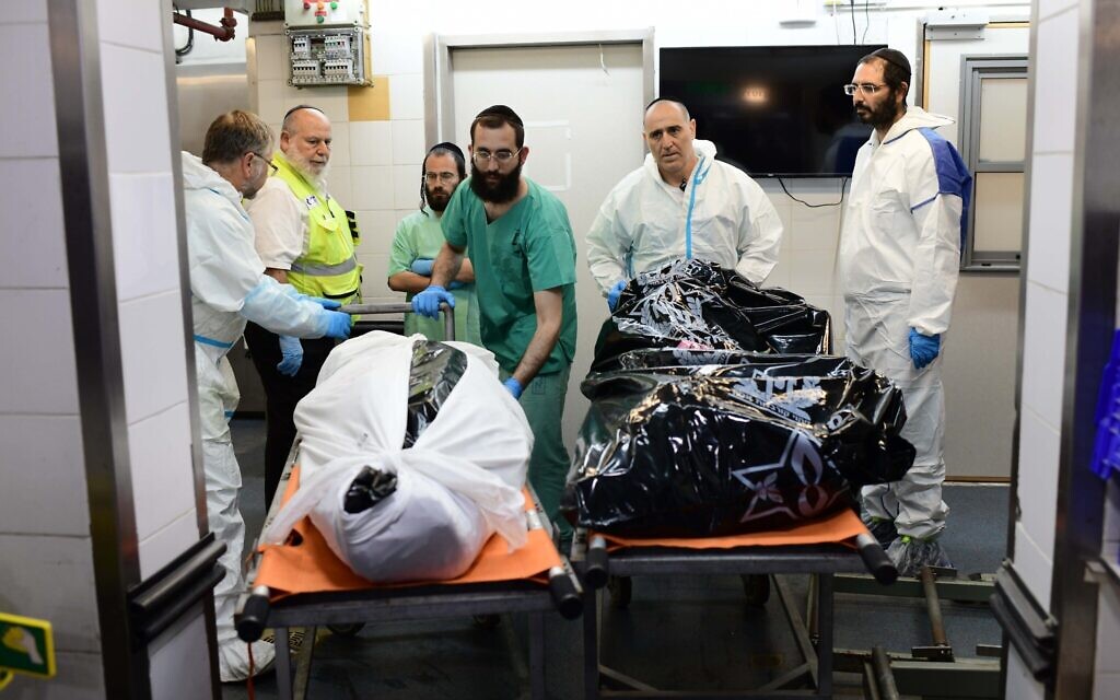 Bodies of the victims of the mass murderous attack by Hamas on southern Israeli communities on October 7, 2023 are brought into the National Center of Forensic Medicine (Abu Kabir) in Jaffa, October 16, 2023. (Tomer Neuberg/Flash90)