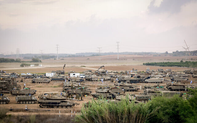 Israeli soldiers at a staging area not far from the Israeli-Gaza border, October 16, 2023. (Yossi Zamir/Flash90)