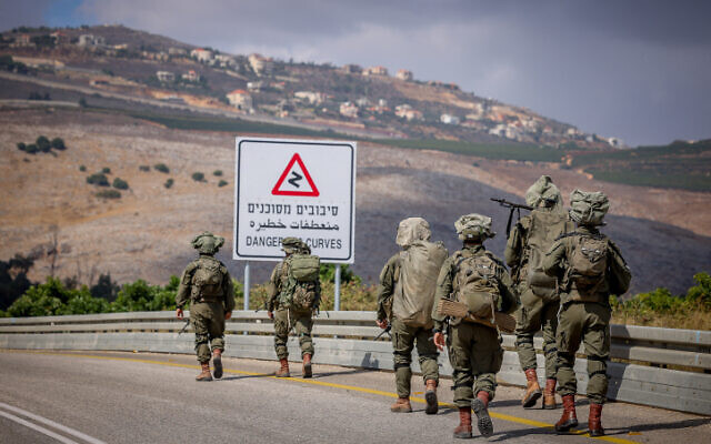 Israeli soldiers patrol near the Israeli border with Lebanon, northern Israel, October 19, 2023 (David Cohen/Flash90)