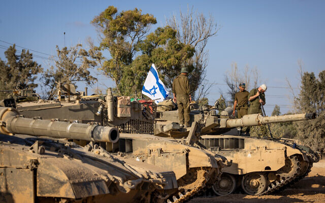 Israeli soldiers at a staging area near the Israeli-Gaza border, October 20, 2023. (Yonatan Sindel/Flash90)