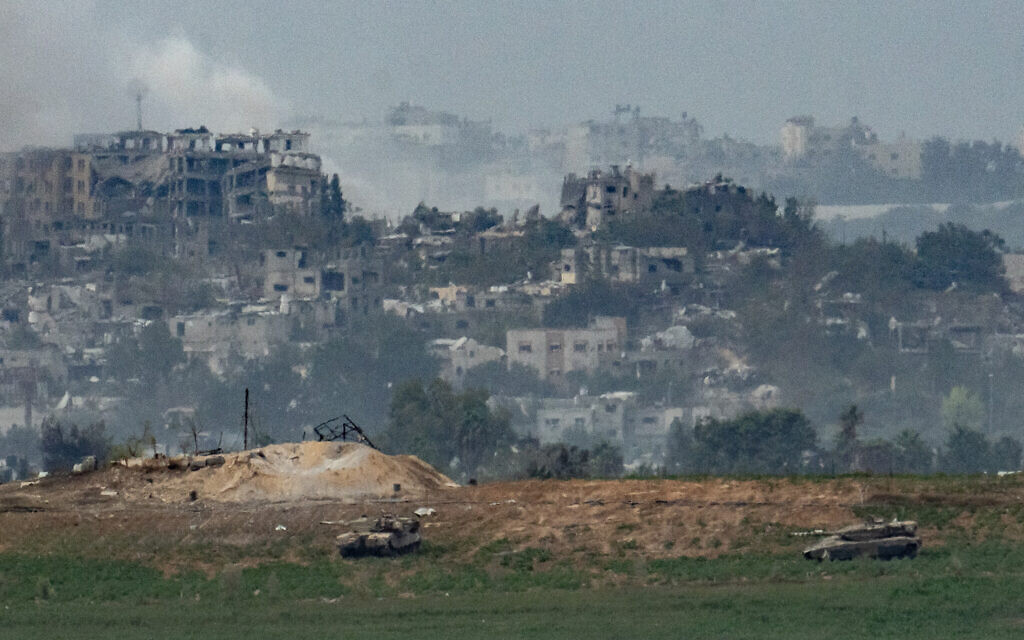 Israeli tanks in the Gaza Strip, as seen from the Israeli side of the border, on October 29, 2023. (Erik Marmor/Flash90)
