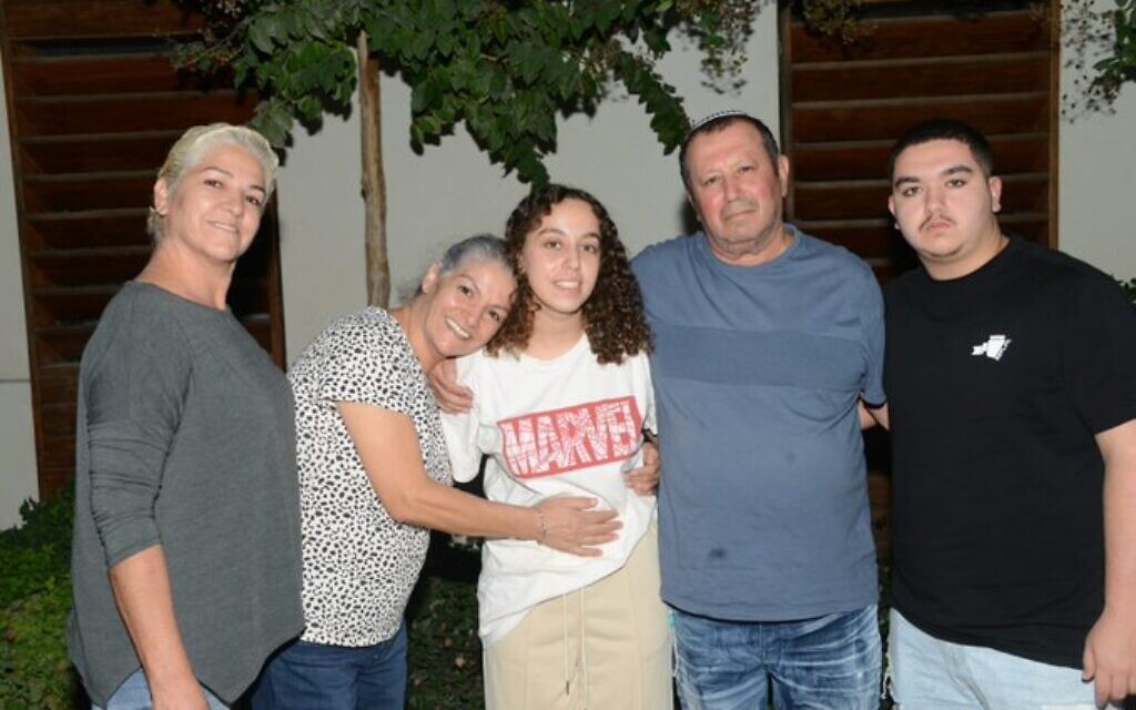 IDF soldier Pvt. Ori Megidish (center) with her family after being rescued from Gaza, October 30, 2023. (Shin Bet)
