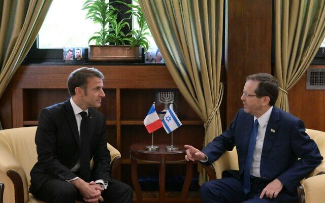 President Isaac Herzog (R) meets visiting French President Emanuel Macron at his residence in Jerusalem on October 24, 2023 (Amos Ben-Gershom / GPO)