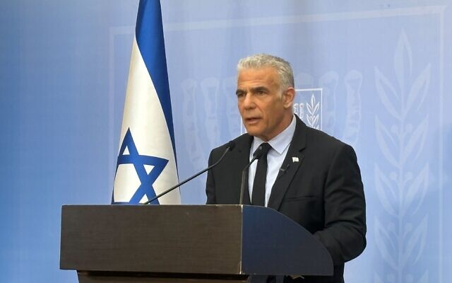 Opposition leader Yair Lapid speaks at the Knesset on October 26, 2023 (Carrie Keller-Lynn/Times of Israel)