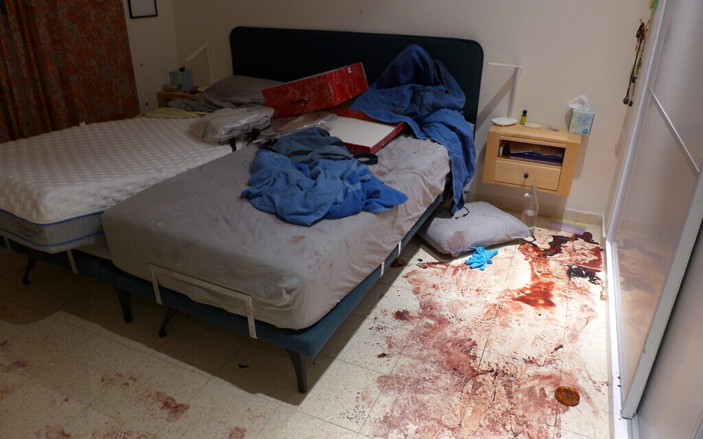 Blood covers the floor of a bedroom of a resident of Be'eri, on October 11, 2023. (Times of Israel/Canaan Lidor)
