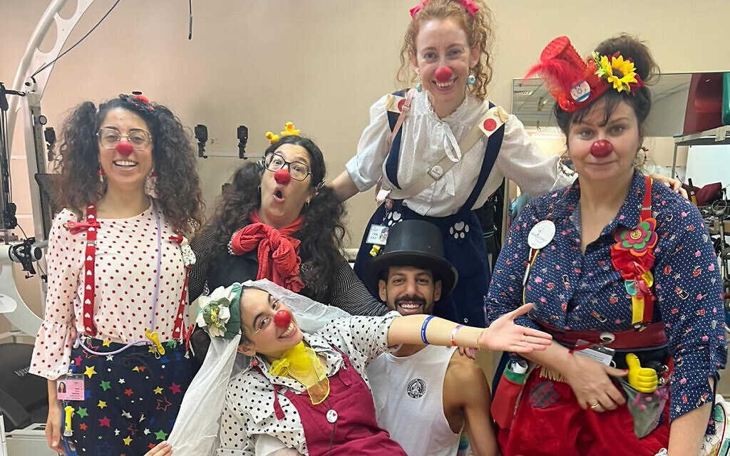 Dream Doctors medical clowns peform a pretend wedding for a nurse and her fiancé, who had to cancel their real wedding because of the Israel-Hamas war. Sheba Medical Center, October 2023. (Dream Doctors)