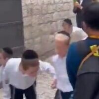 Orthodox Jews filmed spitting at Christian tourists in the Old City of Jerusalem on October 2, 2023. (Screen capture/Twitter)
