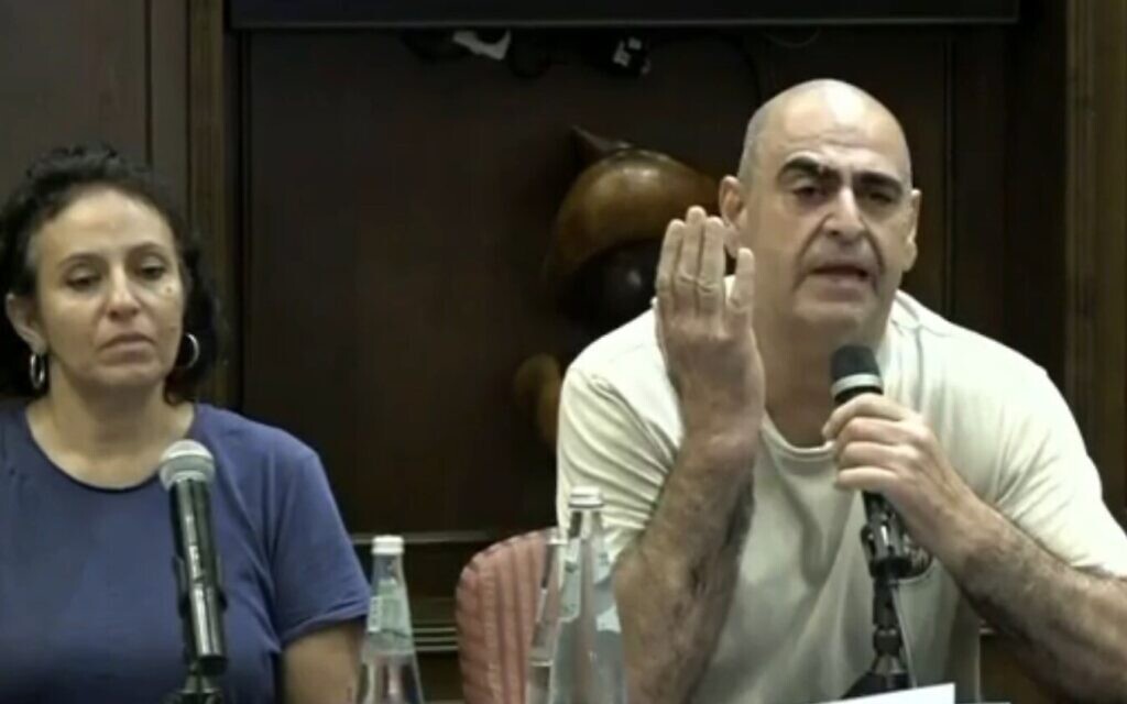 Uri David (right), who has not heard from his two daughters since soon after Hamas terrorists infiltrated into southern Israel on October 7, 2023, speaks during a press conference of families of Israelis whose relatives are missing, October 8, 2023. (Screenshot/used in accordance with clause 27a of the copyright law)
