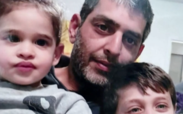 Avigail Idan (left) 3, here with her father Roee and brother Michael, was taken captive by Hamas terrorists on October 7, 2023 from Kibbutz Kfar Aza. Both of Avigail's parents were murdered in front of her before she was kidnapped.(Courtesy)