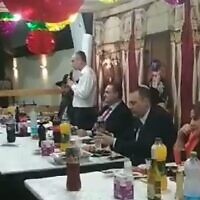 Justice Minister Yariv Levin (L) addresses a Sukkot event held by Rafi Kedoshim in Herzliya in October 2023 (Video screenshot; used in accordance with Clause 27a of the Copyright Law)