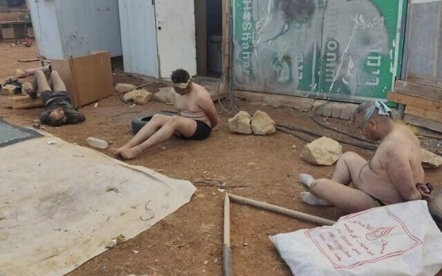 A photo of Palestinians bound and stripped after being apprehended by IDF soldiers and settlers in the central West Bank village of Wadi al-Seeq on October 12, 2023. (Used in accordance with clause 27a of the Copyright Law)