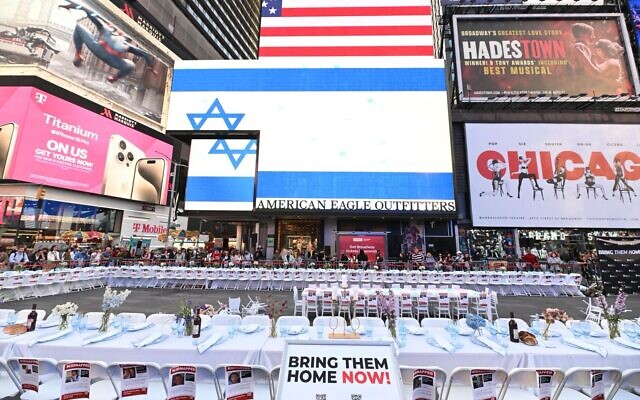 A Shabbat table set for 224 people in Times Square, New York, on October 26, 2023, symbolizing the plight of the hostages held captive in Gaza. (Israeli-American Council)