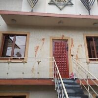Red paint is seen smeared on the facade of the Mordechay Navi Jewish Religious Center in Yerevan, Armenia, following a suspected antisemitic incident on October 3, 2023. (CER)