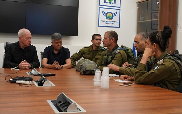 Defense Minister Yoav Gallant meets with Israeli forces in the southern city of Ofakim, October 8, 2023. (Ariel Hermoni/ Defense Ministry)