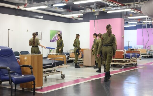 Soldiers help prepare the Sammy Ofer Fortified Underground Emergency Hospital at Rambam Medical Center in Haifa following the outbreak of war, October 11, 2023. (Courtesy of Rambam)